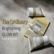 The Ordinary Brightening Glow Kit flat lay skincare set with serum cleanser and moisturizing cream for glowing skin